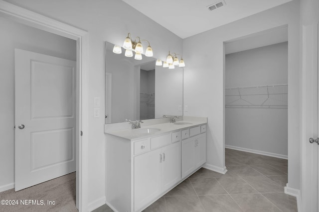 bathroom with tile patterned floors and vanity