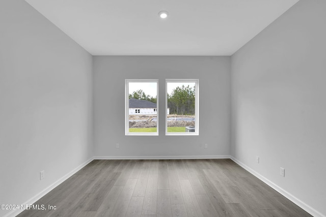 spare room featuring light hardwood / wood-style floors