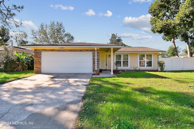 ranch-style house with a front lawn and a garage