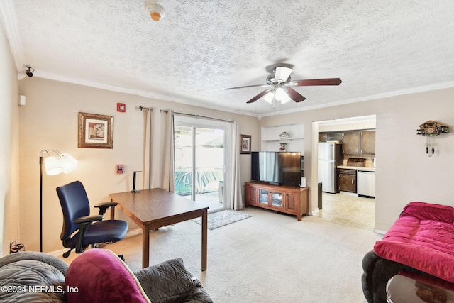 home office with ceiling fan, light colored carpet, a textured ceiling, and ornamental molding