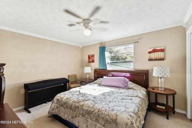 bedroom featuring a textured ceiling, ceiling fan, crown molding, and light carpet