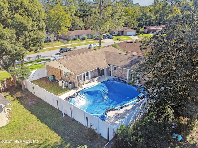 view of pool with a lawn and a patio area