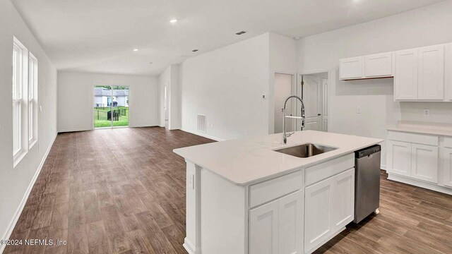 kitchen with white cabinets, dishwasher, a kitchen island with sink, and sink