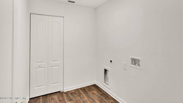 washroom with electric dryer hookup, dark hardwood / wood-style floors, and hookup for a washing machine