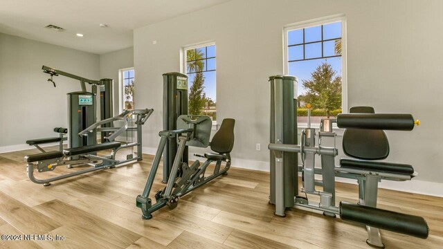 exercise area with light wood-type flooring