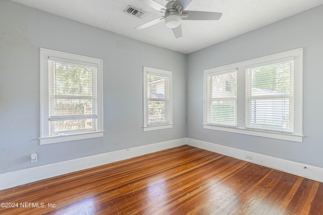 empty room featuring ceiling fan and wood-type flooring