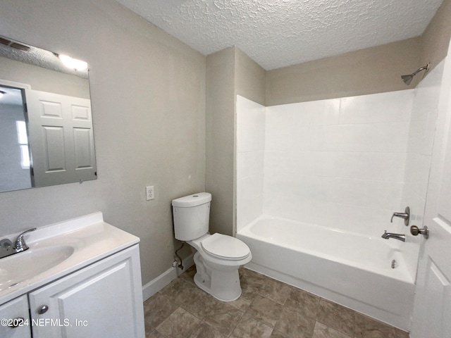 full bathroom with toilet, bathing tub / shower combination, tile flooring, a textured ceiling, and vanity