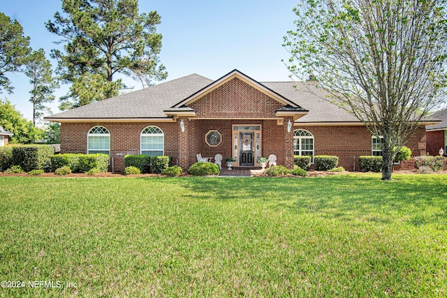 view of front of property with a front lawn and french doors