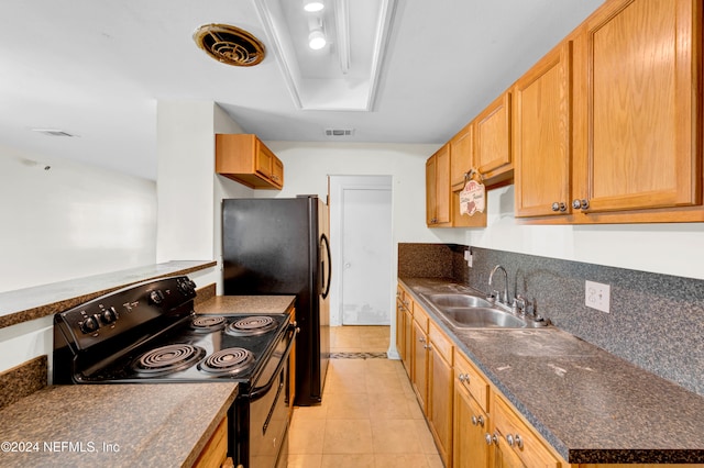 kitchen with sink, black electric range oven, and light tile patterned floors