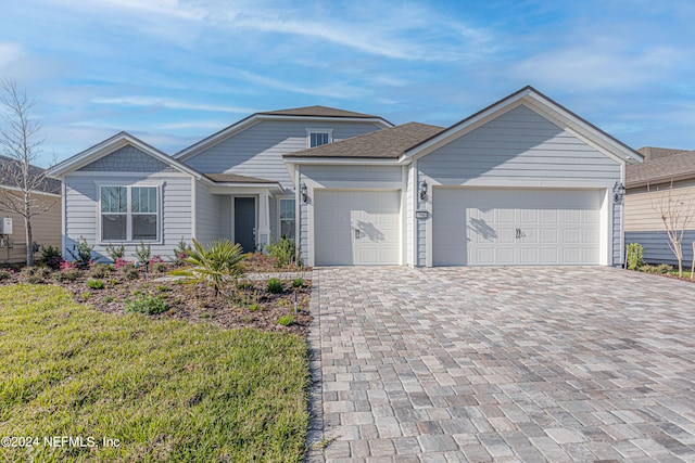 view of front of home with a garage