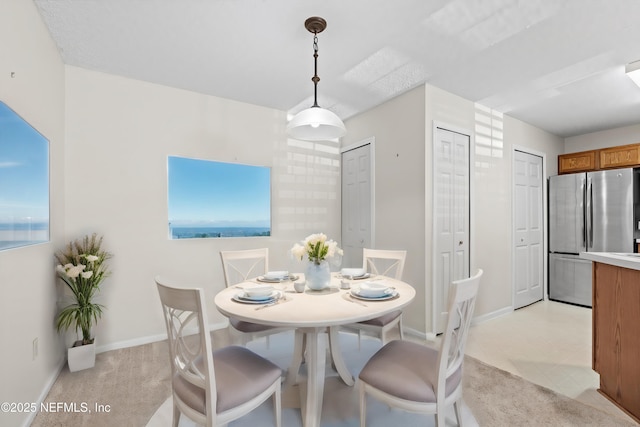 view of carpeted dining area