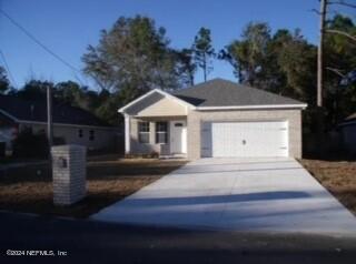 view of front of house featuring central AC unit and a garage