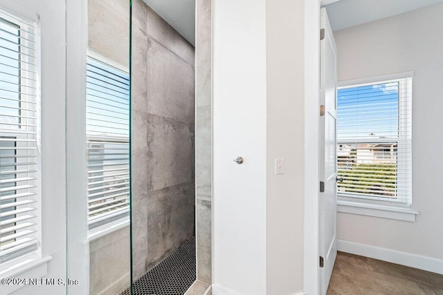 bathroom featuring plenty of natural light and tile flooring