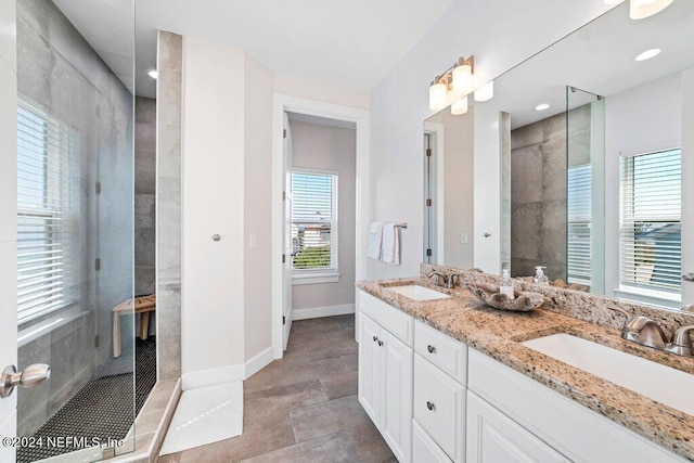 bathroom with double vanity and tile floors