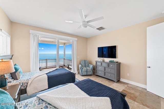 tiled bedroom with ceiling fan, a water view, and access to exterior