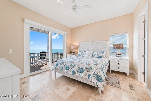 tiled bedroom featuring a water view, access to exterior, and ceiling fan