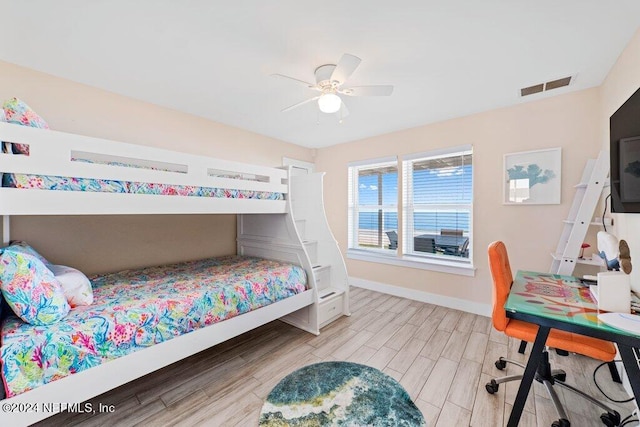 bedroom featuring ceiling fan and light wood-type flooring