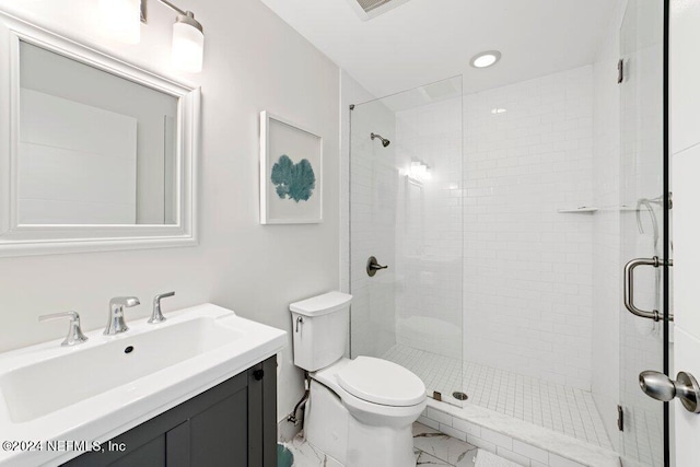 bathroom with a shower with door, tile flooring, toilet, and vanity