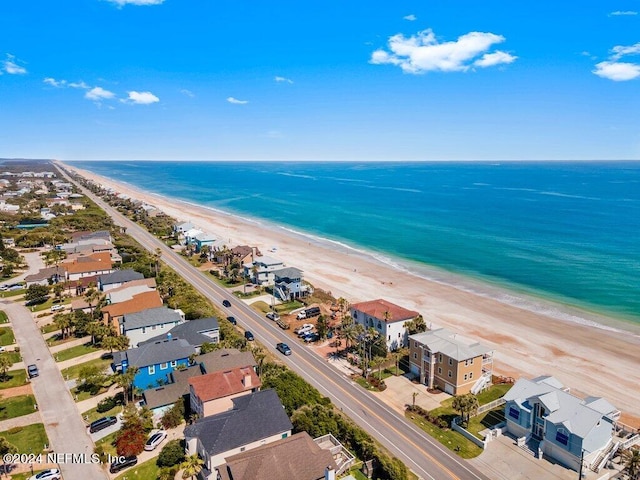 bird's eye view with a water view and a view of the beach