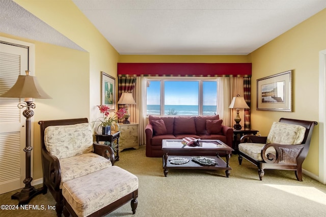 interior space featuring a water view and light colored carpet