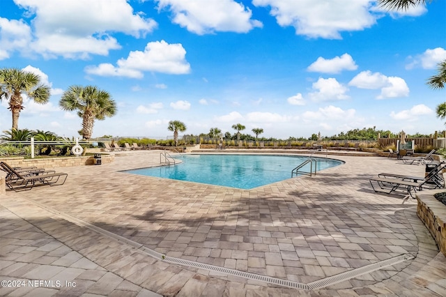 view of pool featuring a patio area