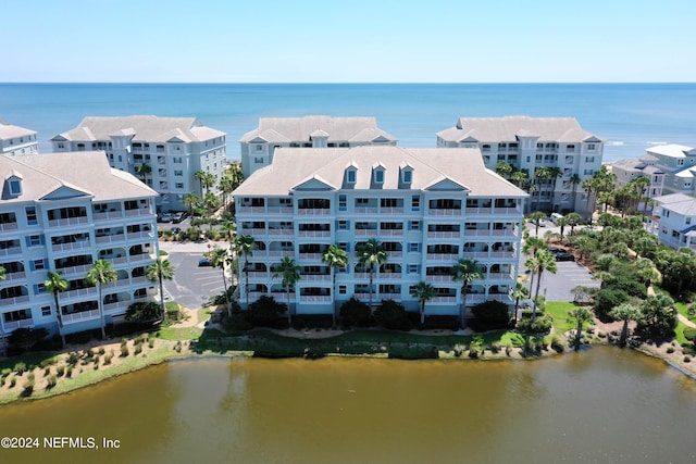 birds eye view of property featuring a water view