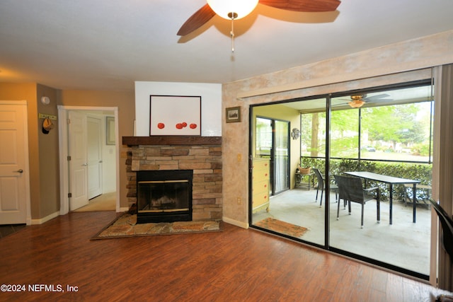 unfurnished living room featuring ceiling fan, hardwood / wood-style flooring, and plenty of natural light