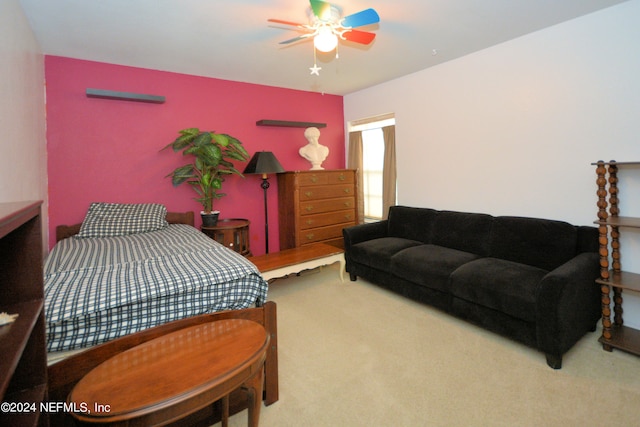 bedroom with light colored carpet and ceiling fan