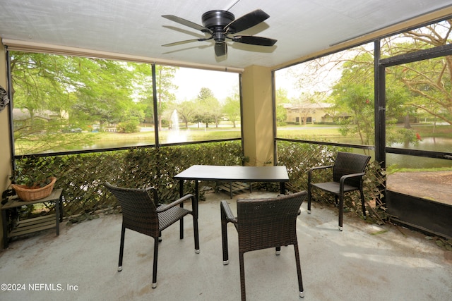 sunroom / solarium featuring ceiling fan and a healthy amount of sunlight