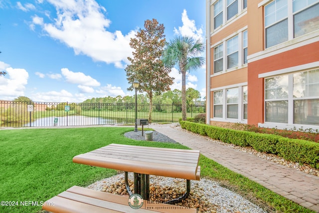 view of property's community with a yard