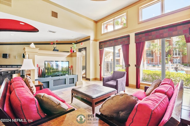 tiled living room with high vaulted ceiling