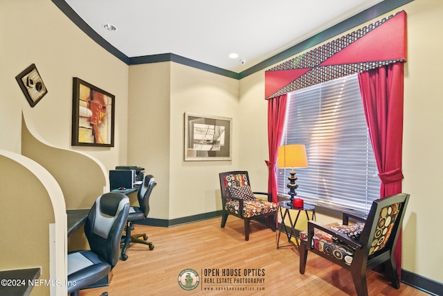 office featuring light hardwood / wood-style flooring and crown molding