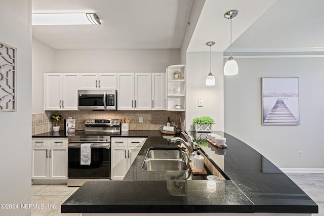 kitchen with range with electric cooktop, light tile floors, kitchen peninsula, pendant lighting, and sink