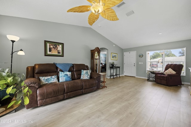 living room featuring lofted ceiling, ceiling fan, and light wood-type flooring