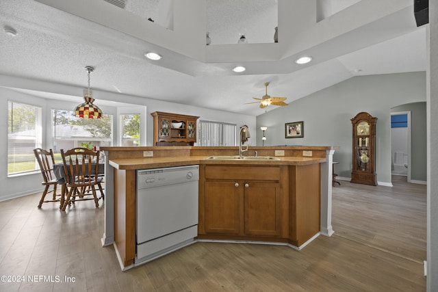 kitchen with light hardwood / wood-style floors, ceiling fan, hanging light fixtures, dishwasher, and sink