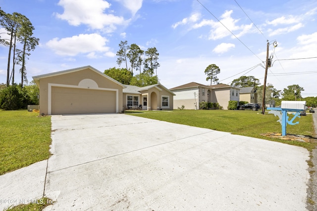 ranch-style home featuring a front lawn and a garage