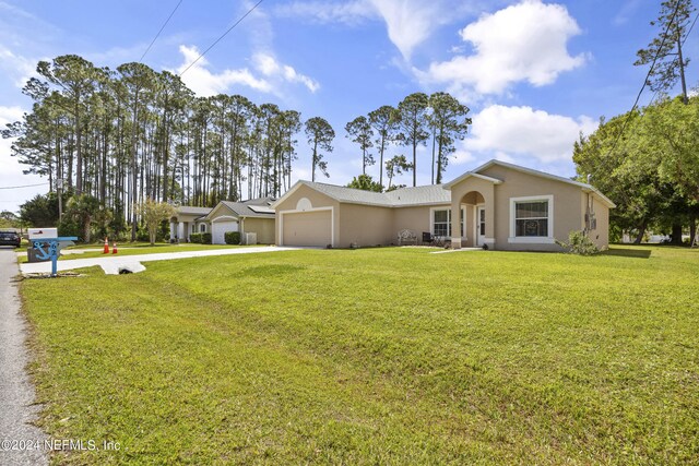 ranch-style home with a front yard and a garage