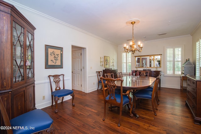 dining area featuring dark hardwood / wood-style floors, an inviting chandelier, and ornamental molding