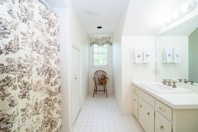 bathroom with vanity and tile flooring