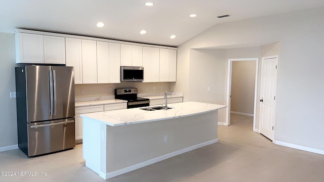 kitchen with lofted ceiling, visible vents, appliances with stainless steel finishes, white cabinetry, and a sink