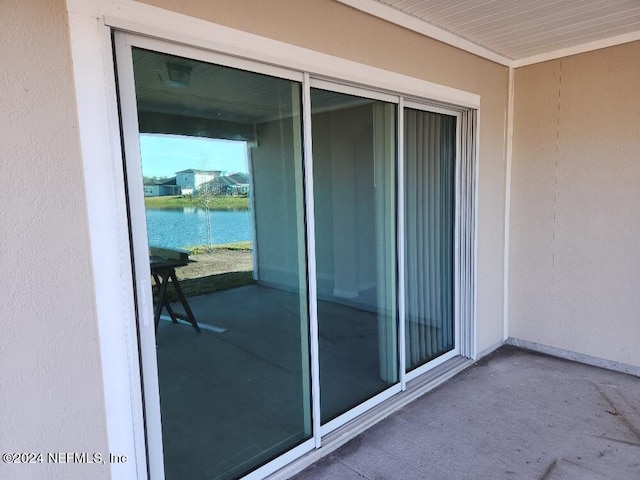 balcony featuring a water view