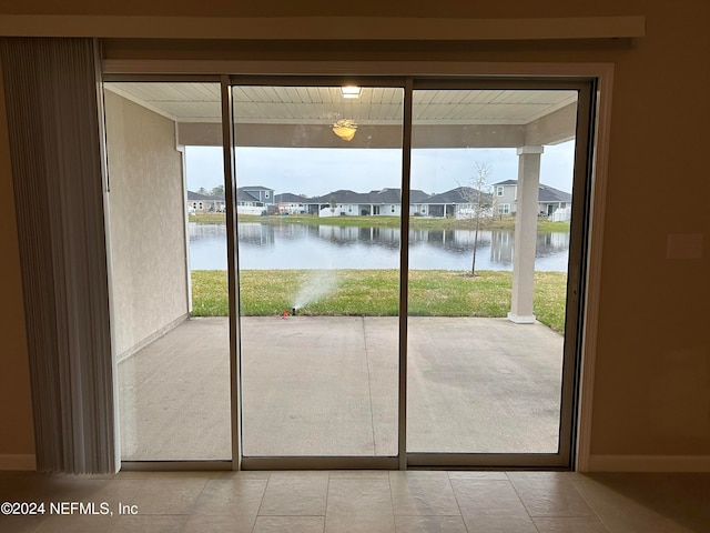 entryway with a water view and a residential view