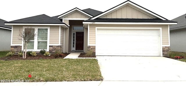 craftsman-style house featuring an attached garage, stone siding, board and batten siding, and concrete driveway