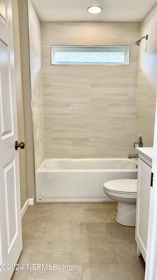 bathroom featuring toilet, vanity, and shower / bathtub combination