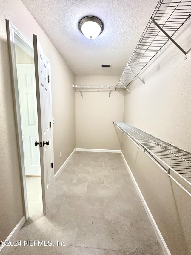 walk in closet featuring visible vents