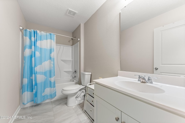 full bathroom featuring toilet, a textured ceiling, vanity with extensive cabinet space, tile flooring, and shower / tub combo