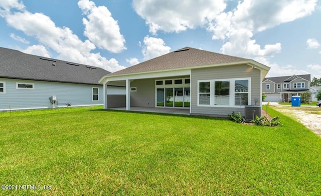 back of house with a patio, cooling unit, and a lawn