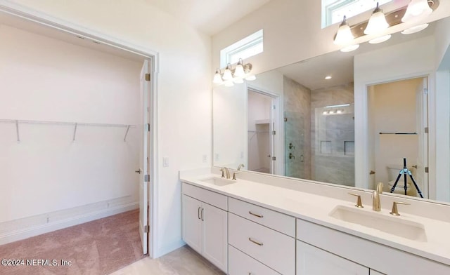 bathroom with vanity and an enclosed shower