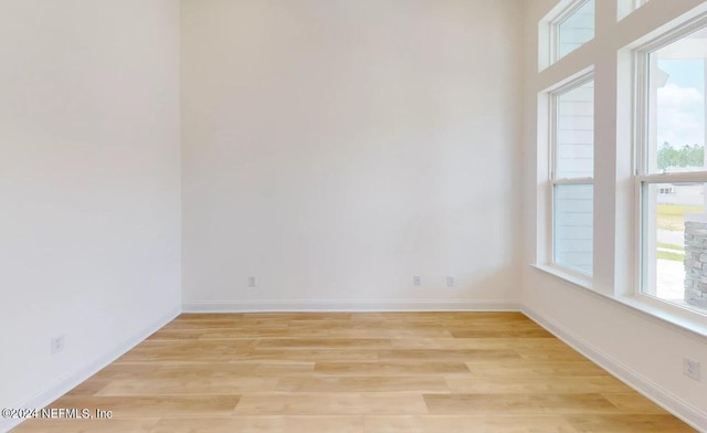 spare room featuring light hardwood / wood-style floors