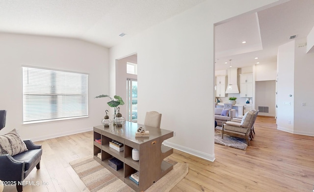 office with light hardwood / wood-style floors